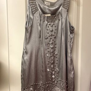 Silver evening dress with studs great for a night on the town. Never been worn.